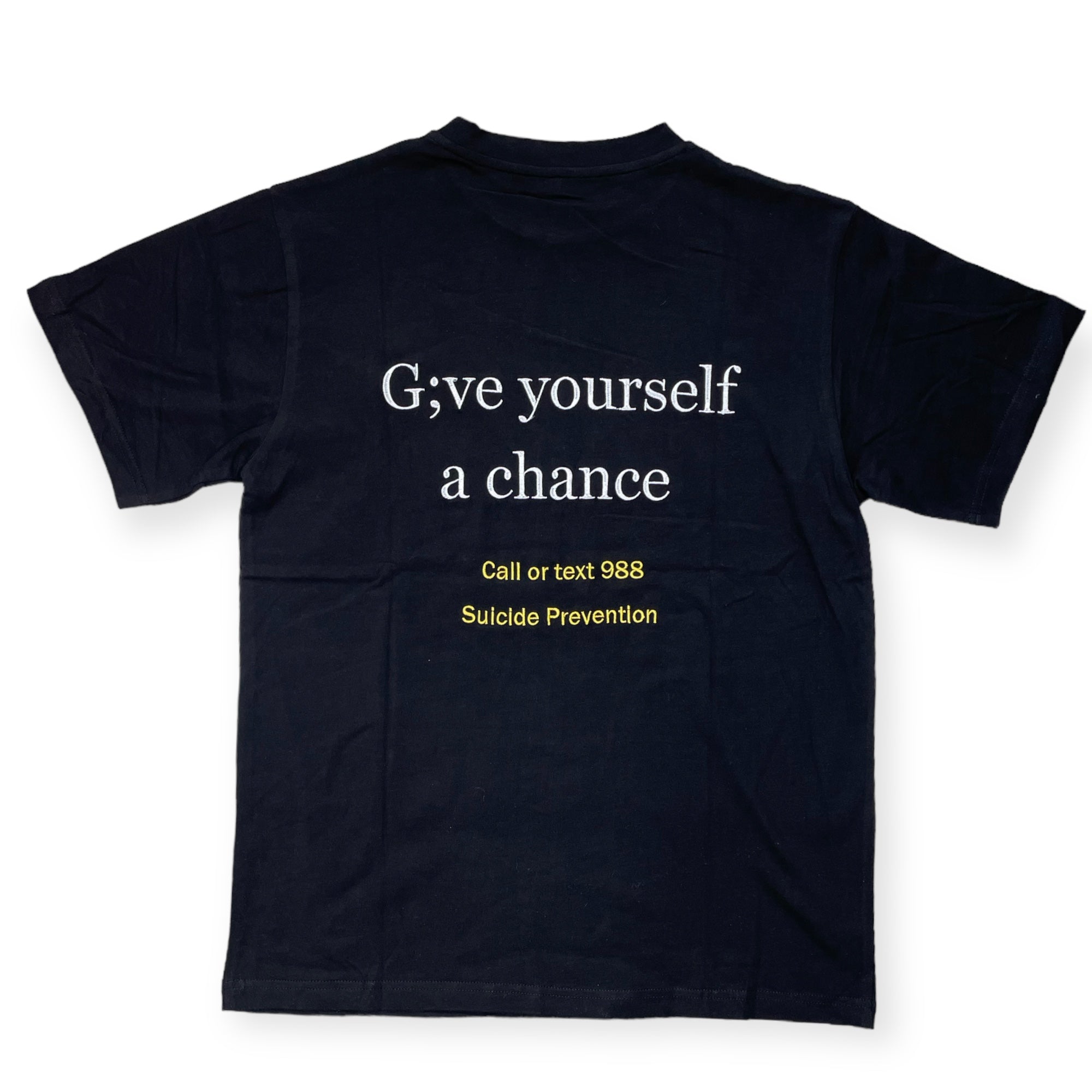 All embroidered mental health merakitay tee shirt. Stigma tee. Semi colon tee. Fuck the stigma, my story continues tee. Suicide prevention hotline tee. Give yourself a chance. Embroidered logo. Black with yellow and white embroidery.