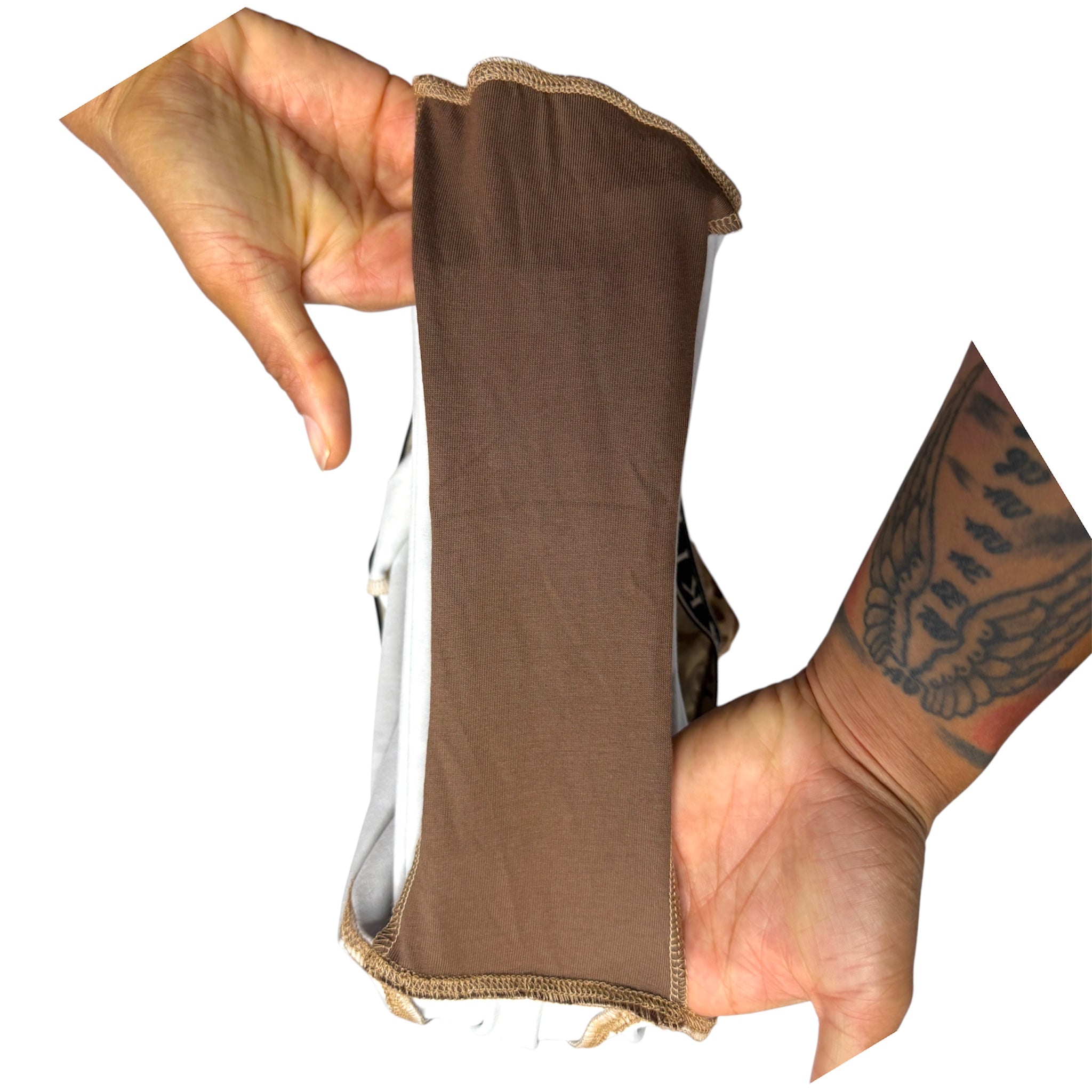 A brown fabric extra piece of fabric in the boxer briefs to flap the pads over.