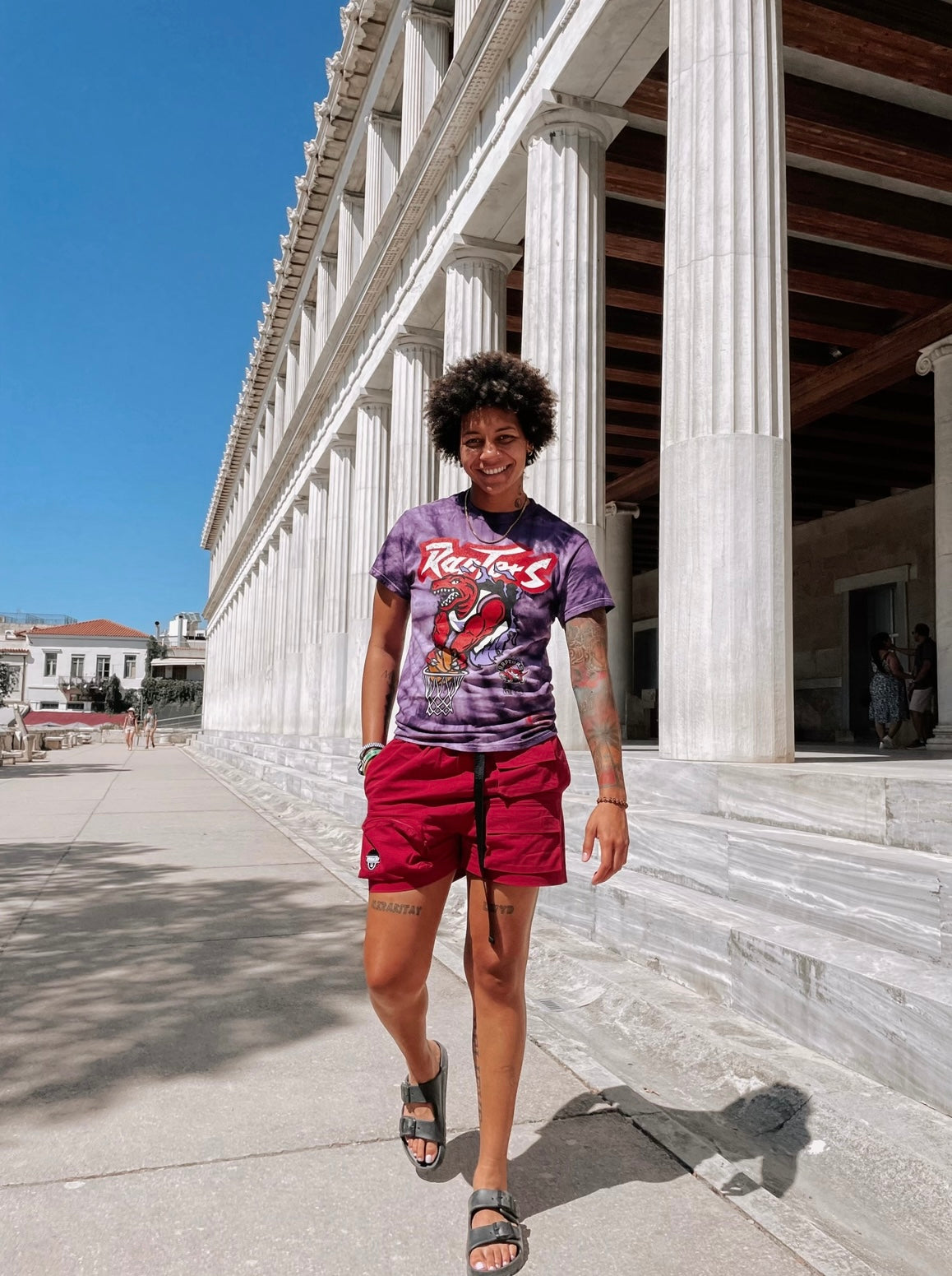 Androgynous or masculine shorts. Gender neutral cargo shorts. Burgundy or red in color, embroidered logo, adjustable waistband, includes belt, and has six (6) pockets. Mid-thigh length, 3-5 inch inseam. Unisex shorts.